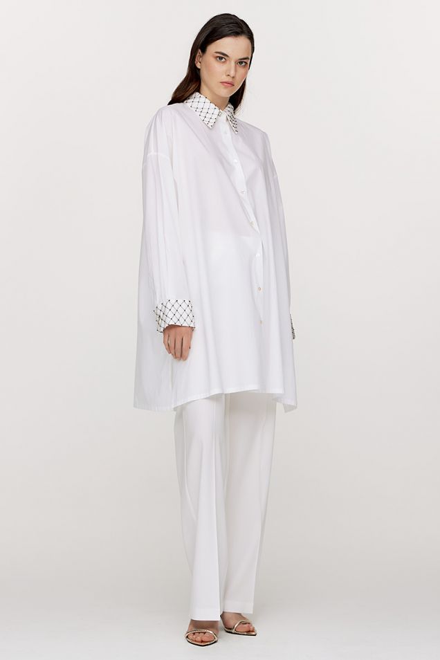 Loose poplin shirtdress with hand–beaded details